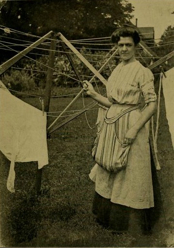 woman hanging laundry on a clothesline