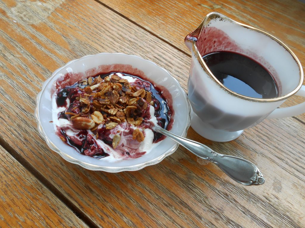 yogurt with granola and black raspberry syrup
