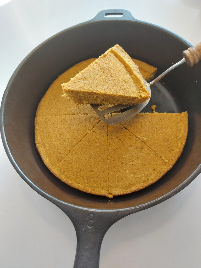 pumpkin cornbread in a cast iron pan