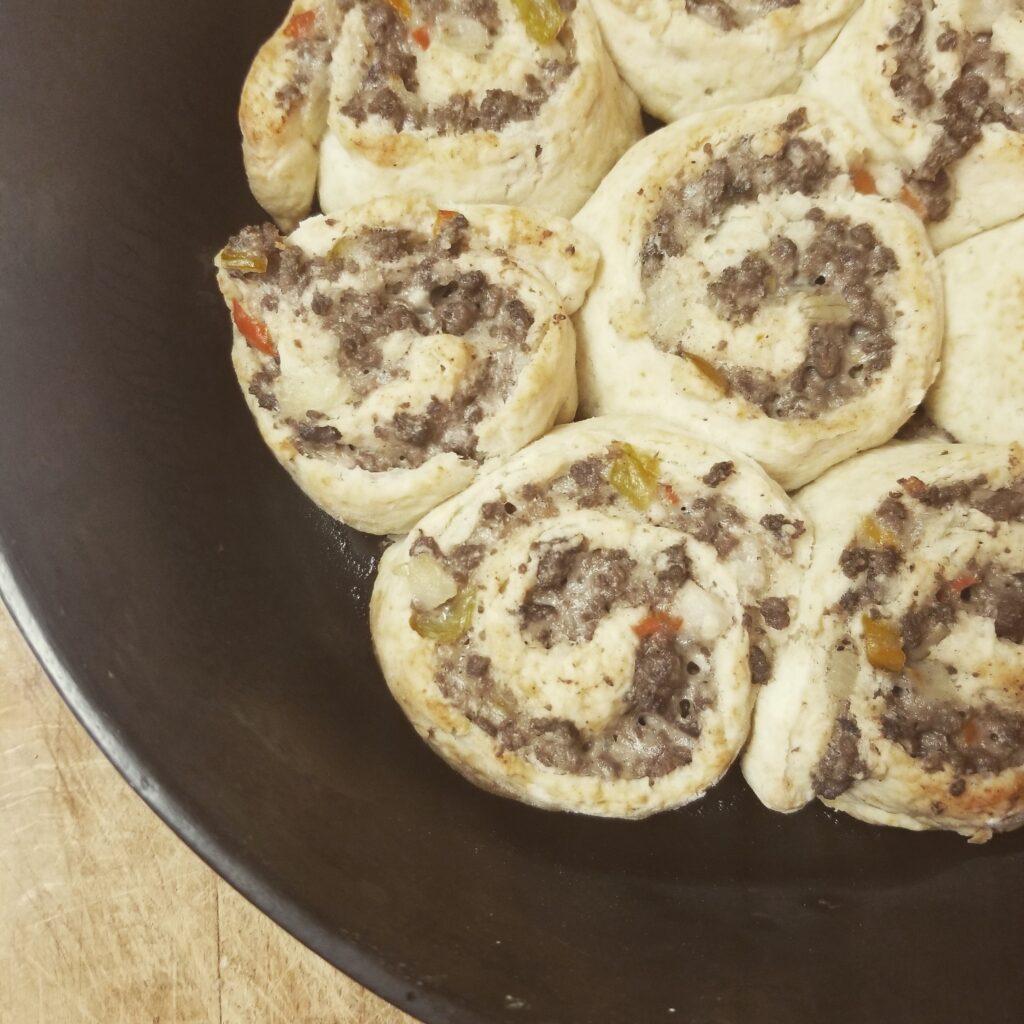 a simple meal. Beef and Biscuit Rolls in a cast iron skillet